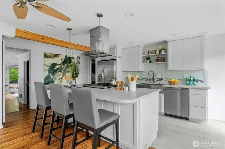 Well-designed kitchen with generous cabinetry, added task lighting, updated fixtures, and modern functionality in this 5-bed Lake Forest Park home.