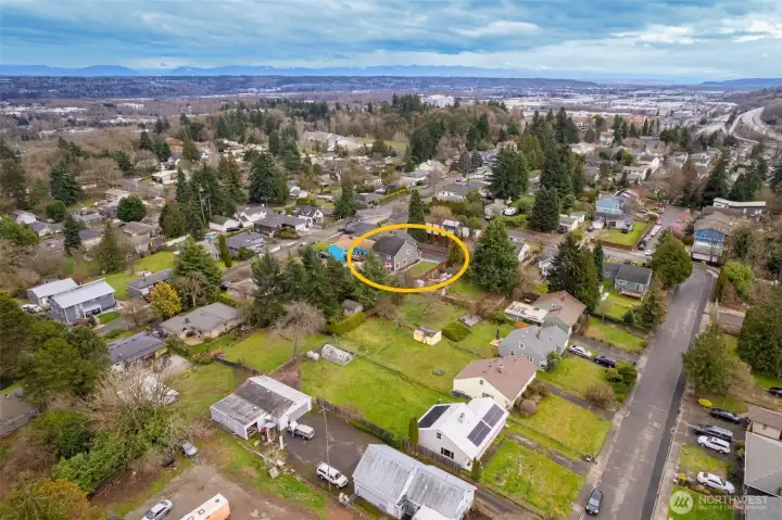 Tucked off of main road with large side yard.