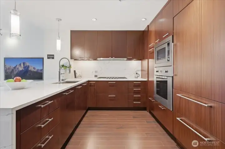 Quartz slab backsplash, Subzero fridge and Viking range