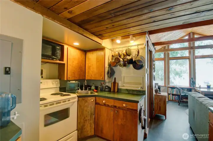 Quaint kitchen with all of the essentials.