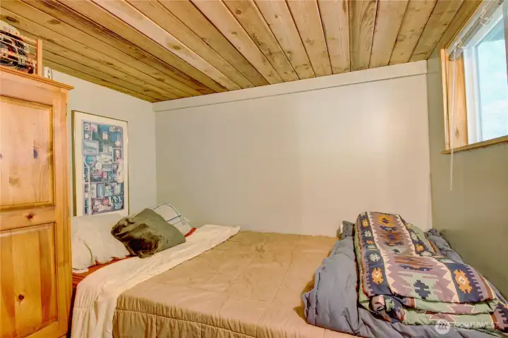 Primary bedroom on main floor of cabin