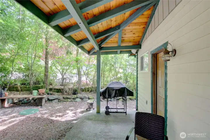 Covered patio on back of cabin allows year round outdoor enjoyment, cooking, and hanging!