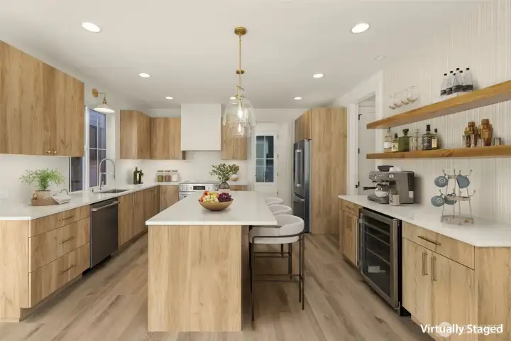 A kitchen designed to gather — generous island, custom cabinetry, and quartz counters.