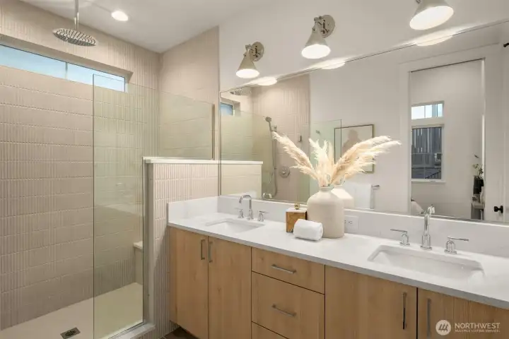 Spa-inspired primary bath with heated floors and thoughtfully selected tile.