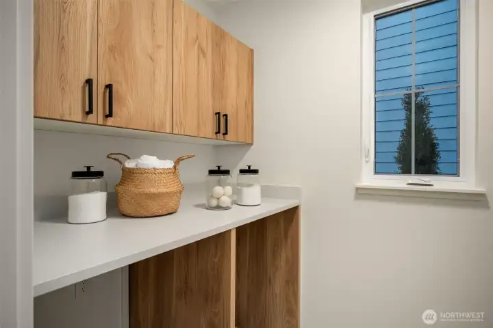 Spacious main floor laundry room.