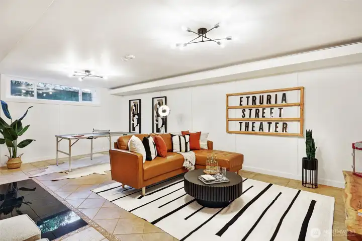 Lower level family room ready for movies, entertaining or game room.