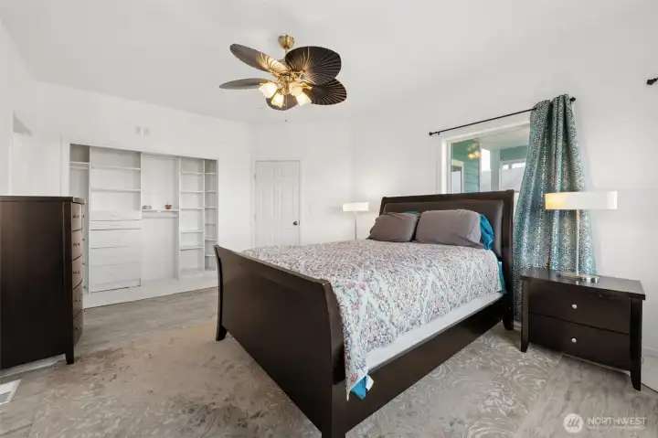 The first of two spacious primary suites on the second floor.