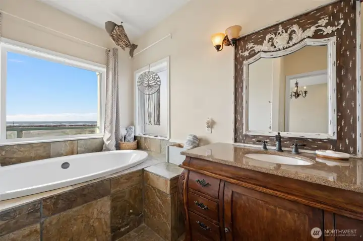 Luxurious soaker tub, also with ocean views in the second primary suite.