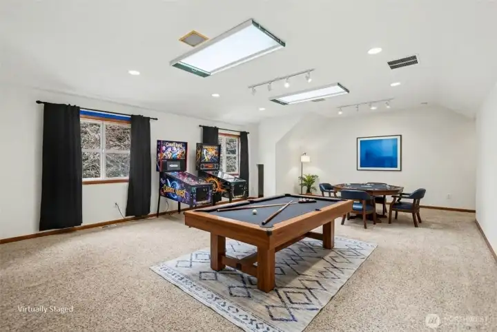 An expansive bonus room is the perfect space for the pool table or home theater with an art studio or 5th bedroom.