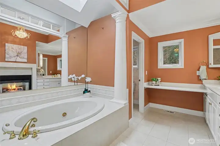 Relax and unwind in this jetted soaking tub & enjoy the warmth of the fireplace.