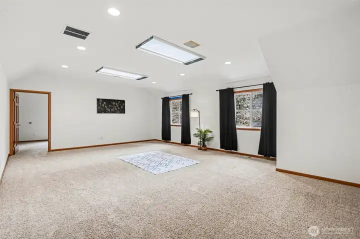 An expansive bonus room is the perfect space for the pool table or home theater with an art studio or 5th bedroom.