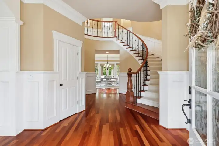 extensive Brazilian cherry floors gracing the main level, flawless, gratuitous millwork, Thick crown molding, wide wood-wrapped hallways and abundant natural light.