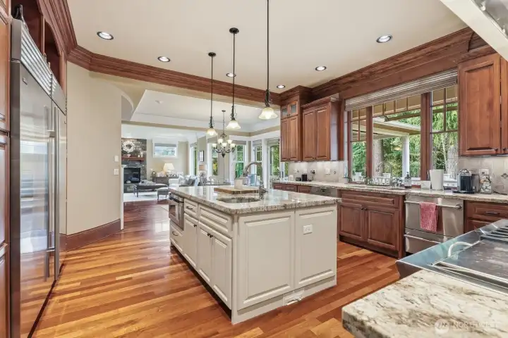 Center island with drawer microwave and 60-inch Subzero refrigerator/freezer.