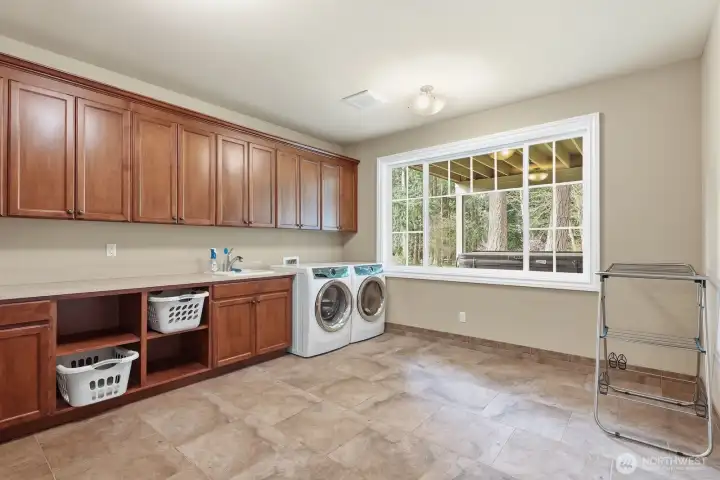 Lower level huge laundry room.