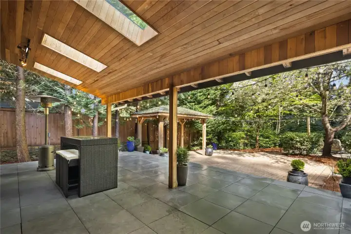 Covered stone patio w/ skylights