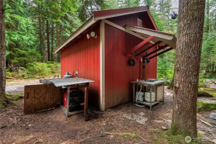 OUTDOOR KITCHEN complete with a sink, stove & fridge creates the perfect space for effortless entertaining. Shed provides (heated) space w/futon for Xtra sleeping and supplies.