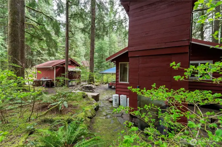 Remote, off grid, surrounded by protected land. 500-gal water tank.