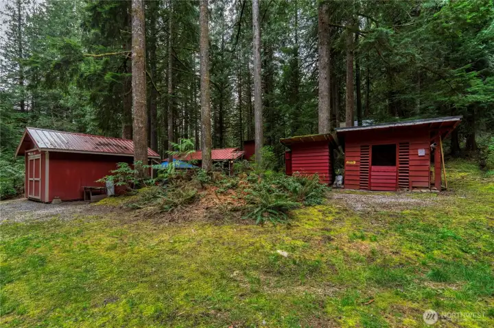 Multiple outbuildings thoughtfully placed. Each structure serves a clear function that enhances daily living.
