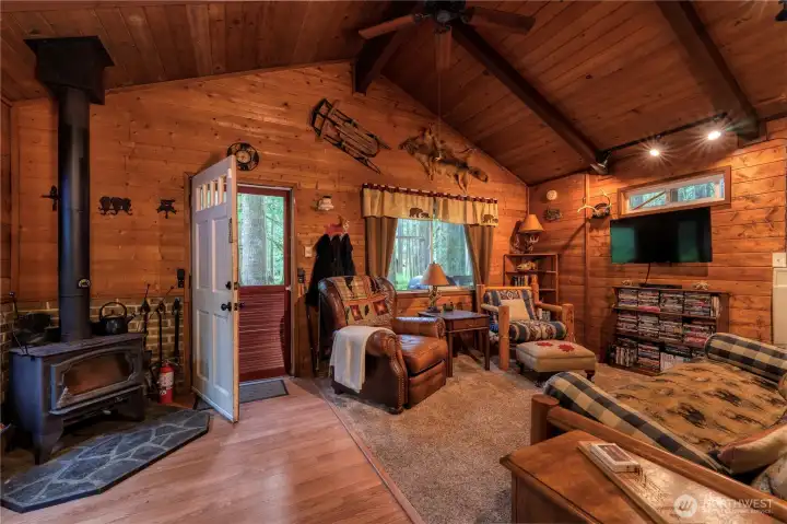 LOPI wood stove provides efficient, reliable warmth through-out the cabin.  A futon provides additional sleeping. Furnishings stay; seller will remove a few personal items.