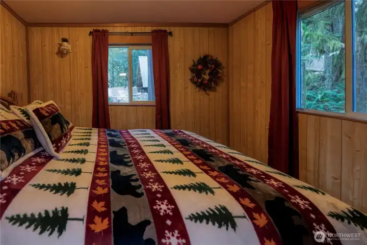 Main floor bdrm w/two storage closets and new vinyl windows.