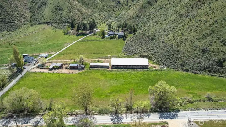 11,808 sq ft enclosed arena, barn, box stalls and corrals all on 3 acres totaling 91.73 acres!