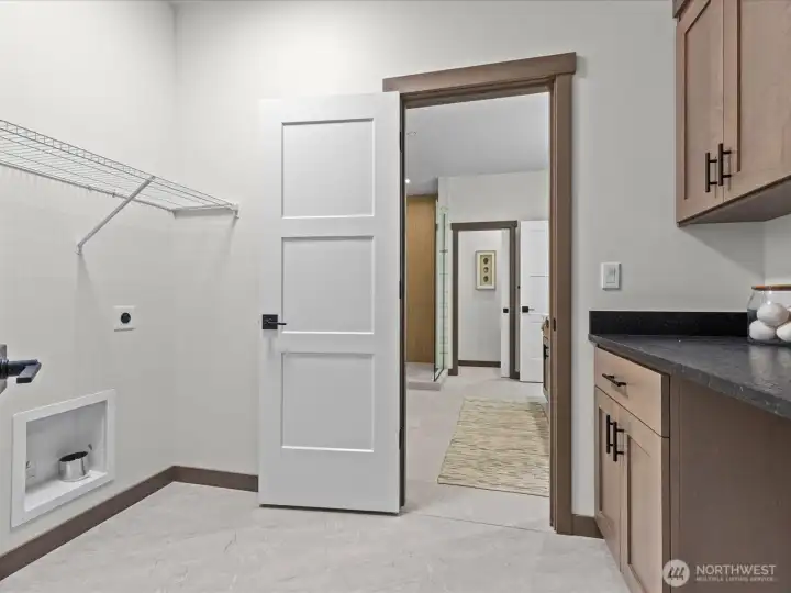 Convenient upstairs utility room.