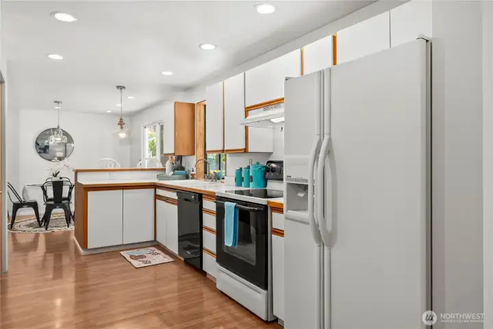 Galley kitchen with breakfast bar, kitchen nook and dining space