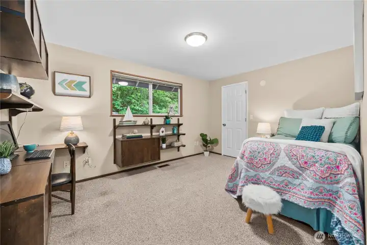 Large main floor bedroom with built in work space