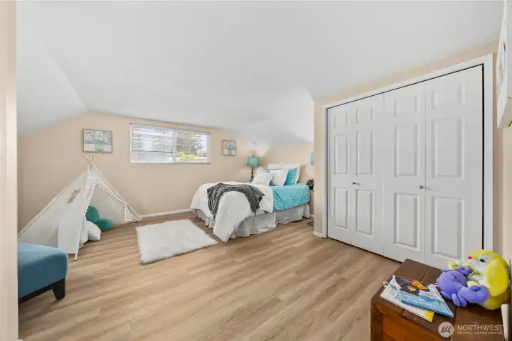 large secondary bedroom upstairs with dual closets