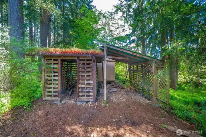 One of two outbuildings, wood shed living roof