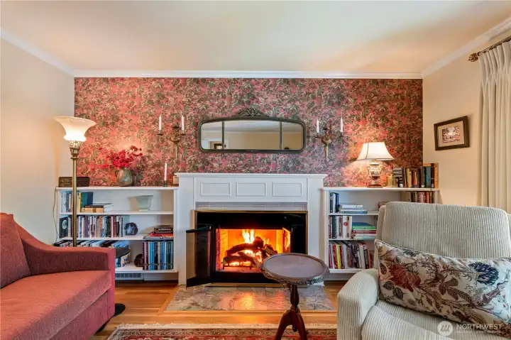 Classic fireplace flanked by bookcases Classic fireplace flanked by bookcases