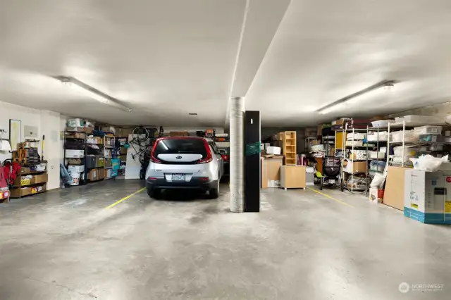 2 secure garage parking spots with storage space in front of the cars. The Kia Soul is in spot 1 and the other spot for this unit is on the right side of the post.