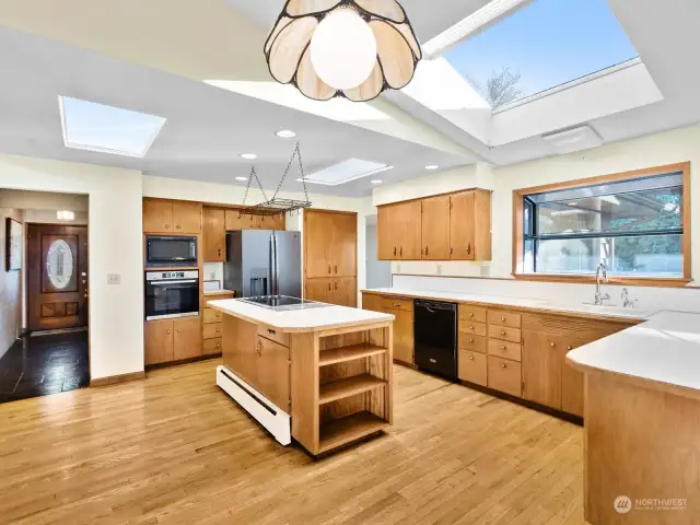 The kitchen with plenty of counterspace and cabinets. This also shows the slate entry.