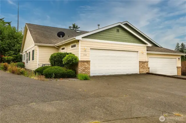 This beautiful townhome is 1408 Sq Ft. exterior has a landscaped path to the front door.