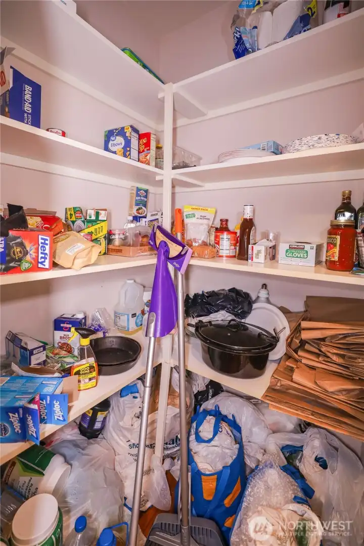 Roomy pantry with loads of shelves to hold all your kitchen supplies.