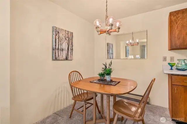 Additional view of dining area and the mirror in the photo also stay with the unit.