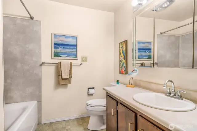 Bathroom has tub and shower combination.