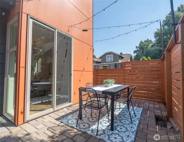 Enough yard in the space for a little outdoor entertaining area.