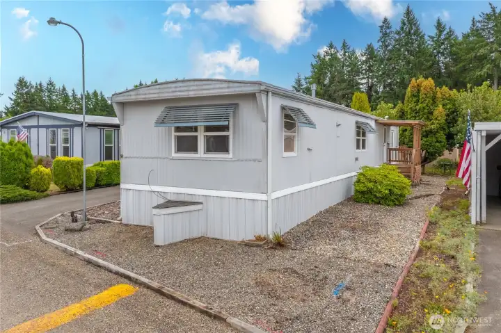 Low maintenance lot - showing the front entrance w/ deck.