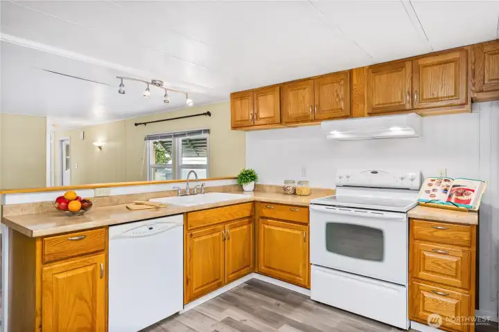 Kitchen offers plenty of counterspace and cabinets.