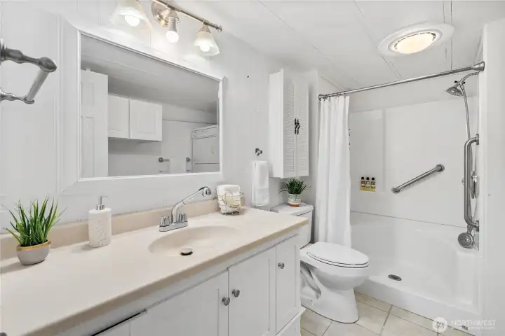 The bathroom was updated over the years to include a step-in shower w/ built in seating.