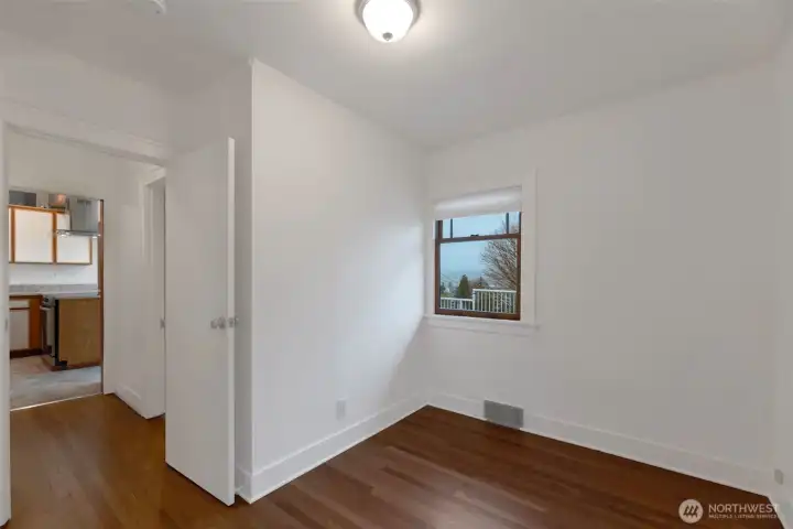 The bedroom off the kitchen could be ideal for an office, workout space or bedroom. Either way, you'll love the deep walk-in closet in this room!