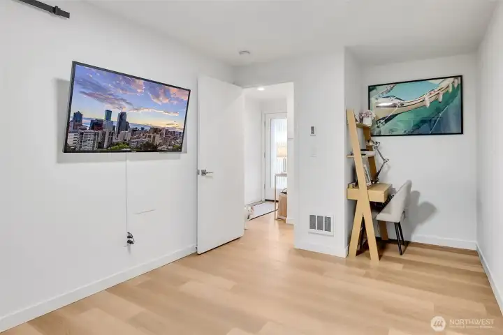 Ground level bedroom has a nice little nook that can be used for a desk for work from home.