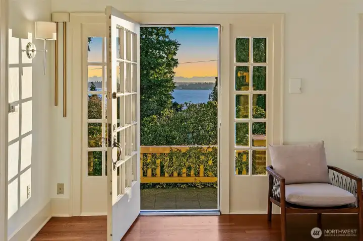 Walls of cottage style windows flood the main rooms with light.