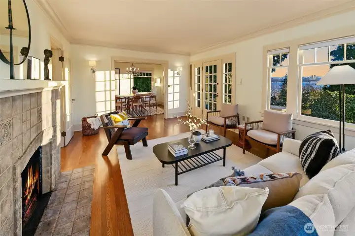 Open living spaces flow seamlessly, and charming original details abound including classic tile fireplace and mantle.