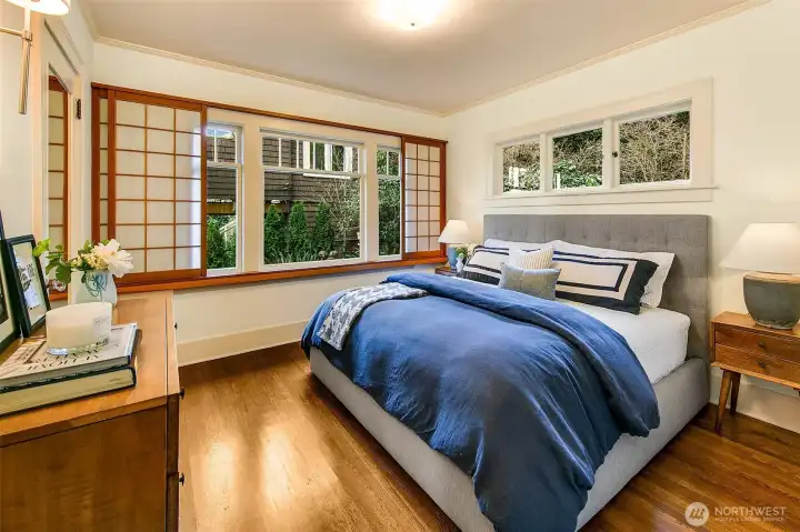 Two large corner bedrooms each facing private and quiet backyard. The SW bedroom easily accommodates a king bed and has lovely sliding window screens.