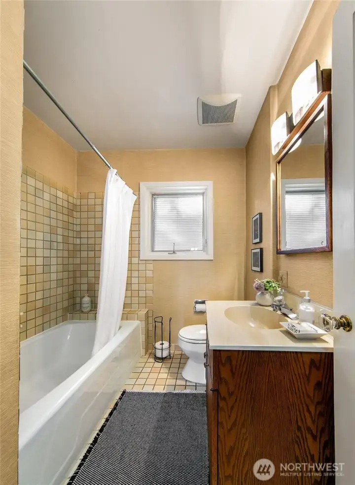 The main floor full bath, plus two linen/storage closets in the hall between the bedrooms provides a wealth of convenient storage.