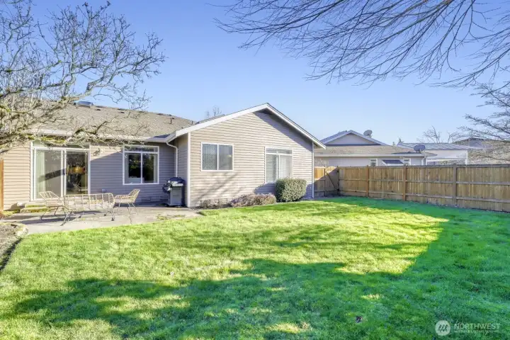 Fully fenced backyard with patio - landscaping is included with HOA!