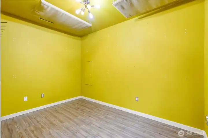 This extra room is built in the converted garage area, could be used as a little office, studio, workout space...you decide!