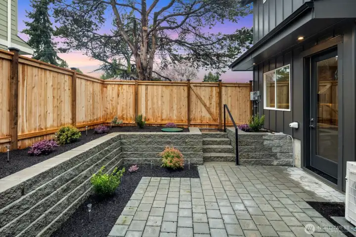 Level and fully fenced patio area - perfect for pets and entertaining outdoors.